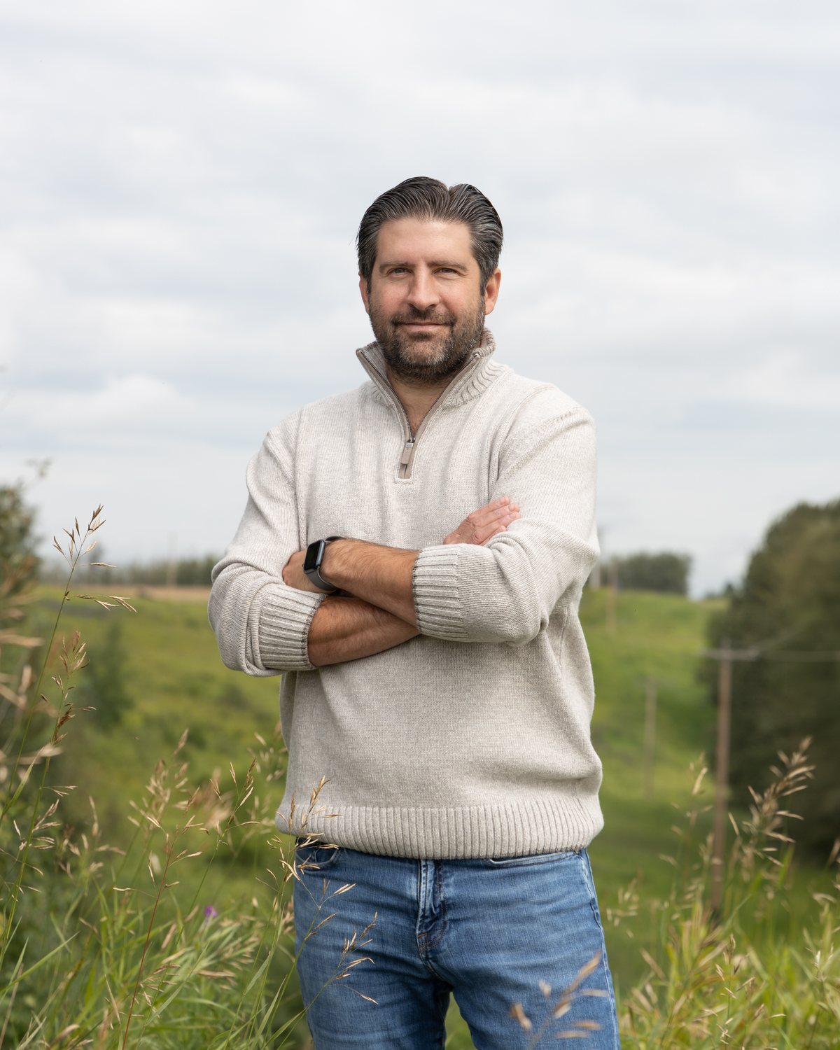 Ben Lotery standing in a field in Lac Ste. Anne &ndash; Parkland