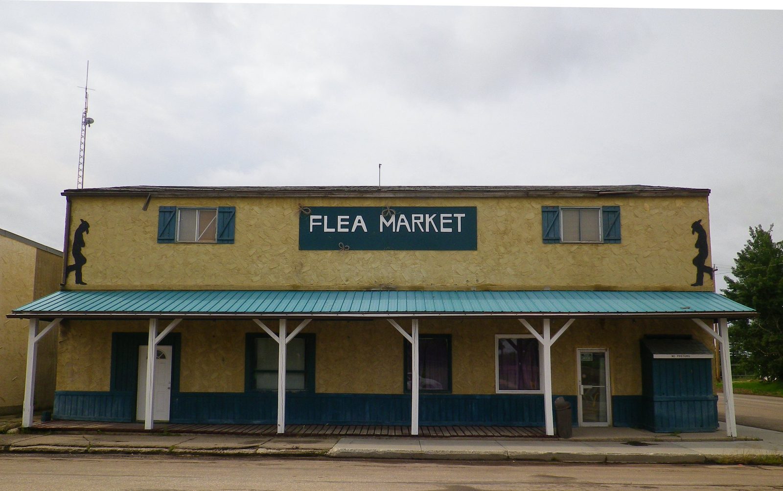 A main-street storefront in Sangudo, Alberta, on a summer afternoon